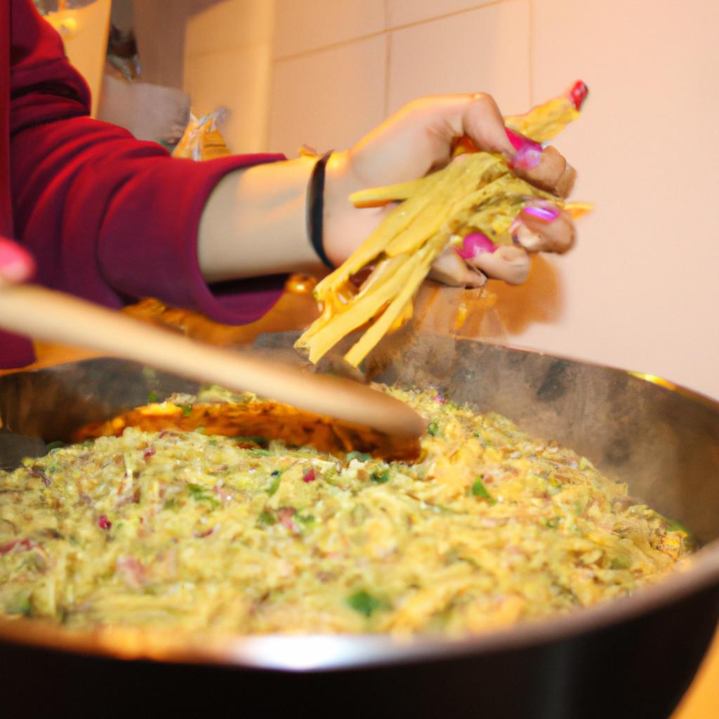 Person cooking pasta in kitchen
