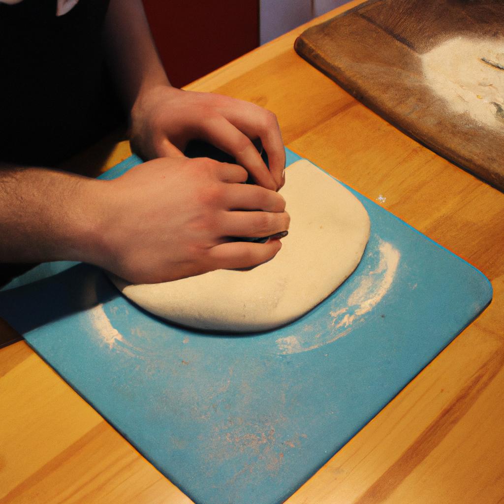Person making pizza dough